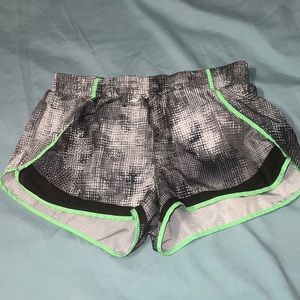 Black white and green athletic shorts